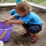 A child playing in the sandbox